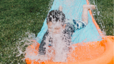 child playing outdoors in water